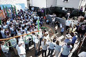 Volunteers converged on The Elizabeth Peabody House last Friday and built a playground for local kids. ~Photo courtesy of Biogen Idec.