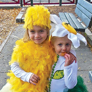 Clio the Daisy and Vienna the Chick stealing hearts at the 10th Annual Pumpkin Stroll on Sunday.