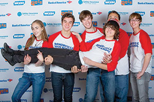 The Somerville High School Trivia Team at the Super Sunday tryout Nov. 3.  Team members take a break for a playful pose. Pictured (from left) are Celine Lessard-Brandt, John Iacovino, Miles Bain, RJ Bingham and Graham Lessard-Brandt holding fellow team member Julian Layton. 