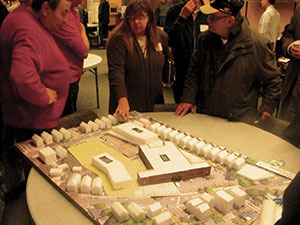 A model of the property being developed by Tufts, which includes the TAB on Holland Street and the site of the current Powder House School on Broadway.