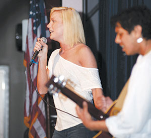 Kourtney-Shea Yurko and Saladin Islam sing and play for the highly receptive audience at this year’s Youth Peace Conference.