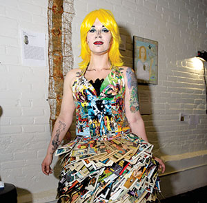 Jackie Olivia wearing her piece “The DC/Marvel Superhero Comic Book Dress”