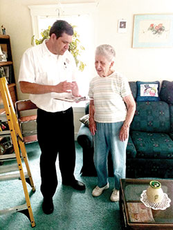 Fire Lieutenant Dave Stiltner speaks with Mrs. Stella Moccia of 71 Putnam Road about the Senior S.A.F.E. program.