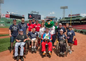 Left to right standing: US Army Veteran Mark Dupras of Taunton; US Marine Corps Veteran Dale Bishop of Norton; Rodriguez; US Marine Corps Veteran Marc Audet of Douglas; Boston Red Sox Team Staff member Ray Fagnant; CVS Caremark Community Relations Senior Director Faith Weiner; US Army Veteran Nick Starling of Somerville; Boston Red Sox Mascot Wally the Green Monster; US Army active duty Michael Sullivan of Shirley; US Army Veteran Steve Fullers of Brockton; US Army Veteran Kathy Siminoni of Seekonk; US Army Veteran Xiaolian Tan of Roslindale.