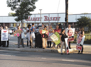 Demonstrators held their ground at the Somerville Avenue Market Basket store in support of ousted CEO Arthur T. Demoulas. ~Photo by Donald Norton