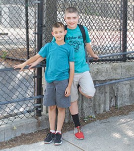 (L to R) Brady Sullivan and Sean Sullivan, on their last day of school, in front of Winter Hill Community Innovation School.