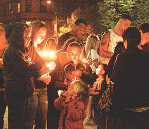 Friends and family members of drug abuse victims gathered seek understanding and healing at Somerville Overcoming Addiction’s candlelight vigil held at Somerville High School last week.~Photo by Gabriela C. Martinez. 