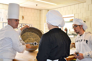 Chef Jeffrey Stuart (left) enjoys teaching a new generation of culinary artists the finer points of cooking.