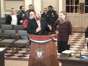 Alderman Matt McLaughlin presents Carrie Dancy with a  citation from the city.