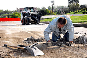 Filling in after the dig out. A lot of road repair is necessary due to the withering effects of this year’s snow removal efforts. 