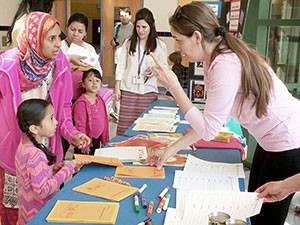 In collaboration with the Somerville Farm to School Project, the Somerville Family Learning Collaborative held Literacy Pop-Up Events at eight Somerville schools in June 2014 that were attended by over 500 families.