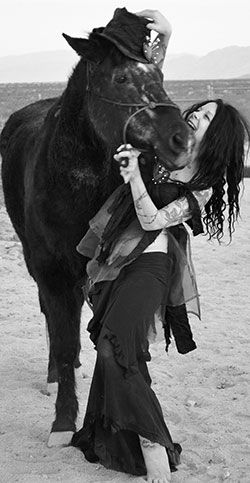 Napolitano at her “Ranchette Johnette” home in Joshua Tree, CA, with her horse, Star. — Photo by Amber Rogers