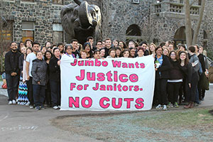 Tufts students protested the impending custodial worker layoffs scheduled for next year at Friday’s unveiling of the new “Jumbo” statue recently donated to the campus. ~Photos by Brianna Moody 
