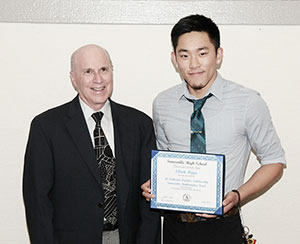 Jay Landers congratulates Elliot Rippe on winning the Lt. Catherine M Landers Scholarship from the Somerville Math Fund.