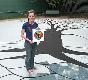 Crystal Rene´ Burney has been beautifying various spaces in Somerville, such as the Trum Park Playground, pictured here, and will now be creating a mural for the new US2/Workbar headquarters in Union Square.