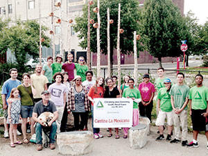 Volunteers, program employees, and other participants gathered at the South Street Farm for a “Cleaning and Greening” event on July 9.