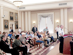 Mayor Curtatone and members of the community looked on as interim Somerville Fire Chief Sullivan addressed the meeting, speaking in favor of the proposed 515 Somerville Ave. location for the city’s new fire station. ~Photo by Josie Grove