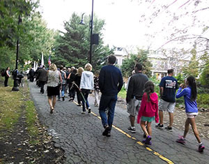 Vigil attendees walked the Community Path from Cedar St. to the site of the ceremony in Davis Square.