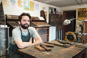 Eli Epstein runs Union Press, a letterpress print shop at 440 Somerville Avenue. His company specializes in prints made from hand-set wood and metal type, as well as hand-cut wood and linoleum blocks. 