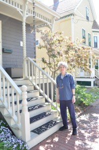 19 Campbell Park owner in front of her restored porch and garden.