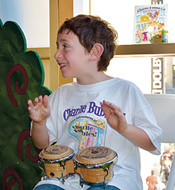 The living inspiration for the Charlie Bubbles book series, Charlie Carafotes, sits in on the bongos during a recording session for Sing With Charlie Bubbles, the companion CD to the books.