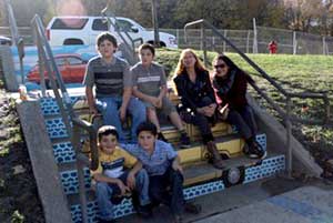 MiMi O' Shea. and her sons with mural artist Liz LaManche.