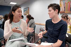 Eunice Kwon (left) and Colleen Morrissey discuss experiences with ageism, during a recent forum at Somerville-Cambridge Elder Services about age discrimination and cultural perceptions of aging.