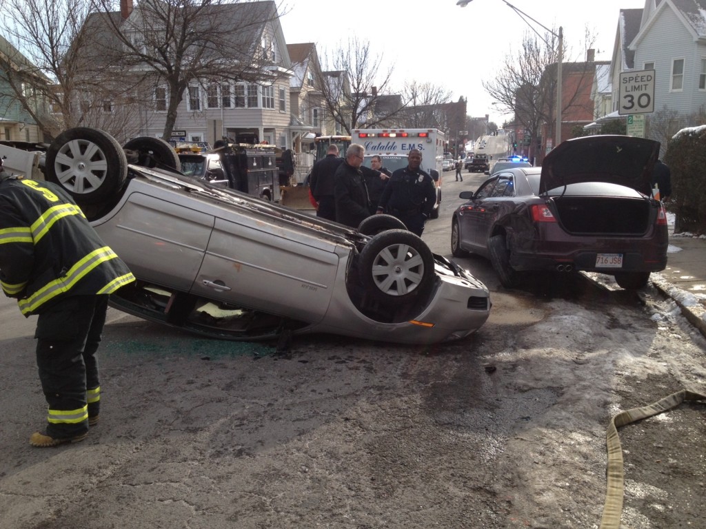 Car flips over after crashing into Somerville Police cruiser